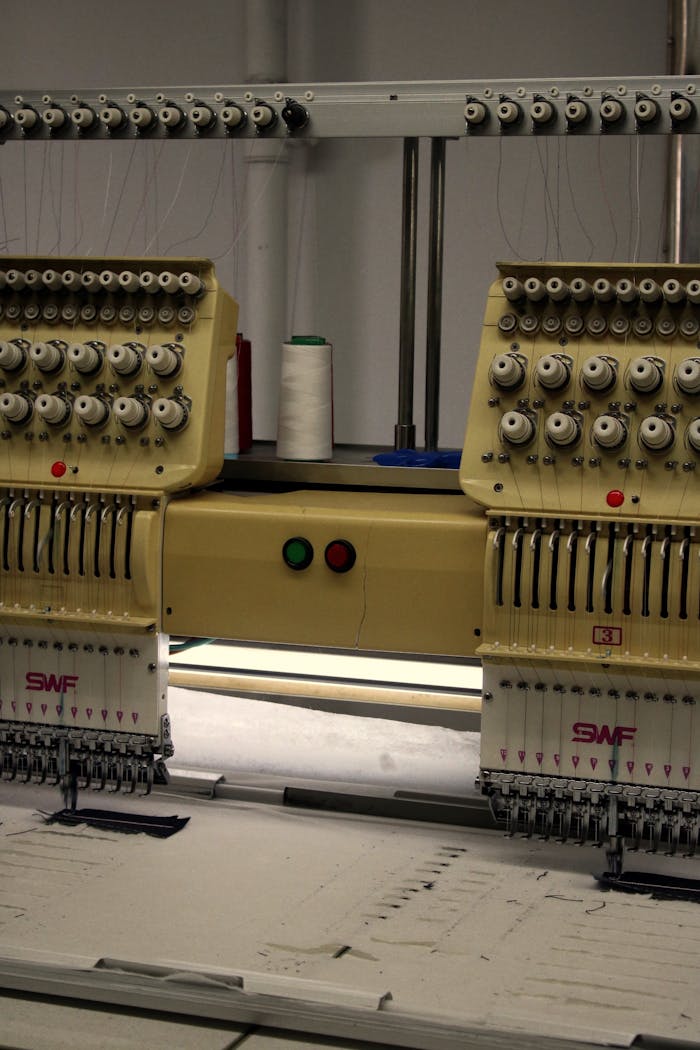 Close-up of an industrial embroidery machine used in textile production.